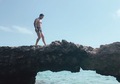 Handsome young man walking on a rock - PhotoDune Item for Sale
