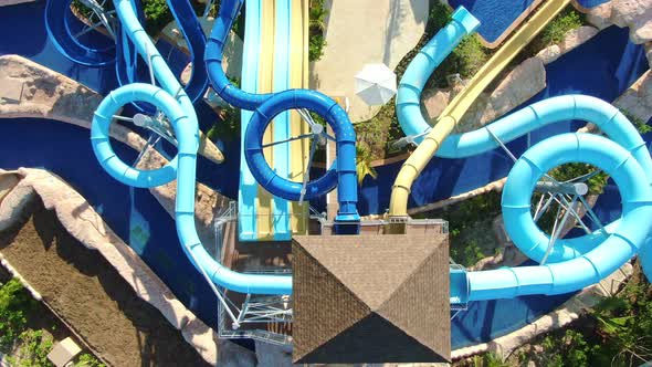 AERIAL DIRECTLY ABOVE Water Slide Park Of Tropical Luxury Resort