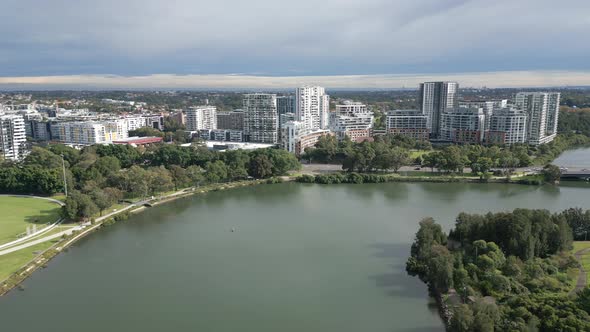 Aerial cinematic birds eye view drone flyover and around downtown area capturing modern townscape ap