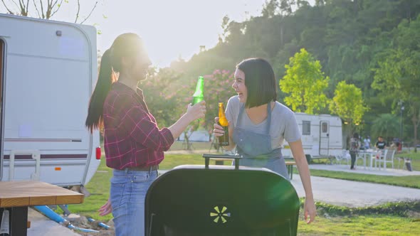 Group of Attractive women enjoy holiday picnic party trip outdoor in evening together on vacation.