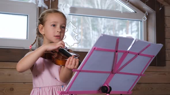 Creative Children Playing Song on Violin at Home