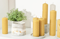 beeswax candles for home decor on a shelf with concrete flower pots. hand made candles - PhotoDune Item for Sale