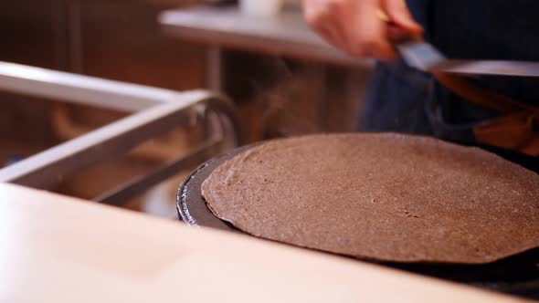 Chef preparing crepe on the pan