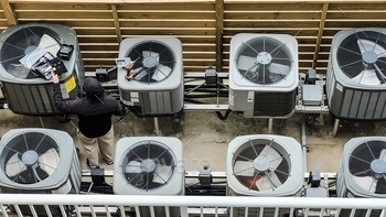 hiring a air-conditioning company to lift the units off the ground to prevent rust buildup as well as enclosure to keep airconditioners out of harsh weather condition using hvac technician for hvac..