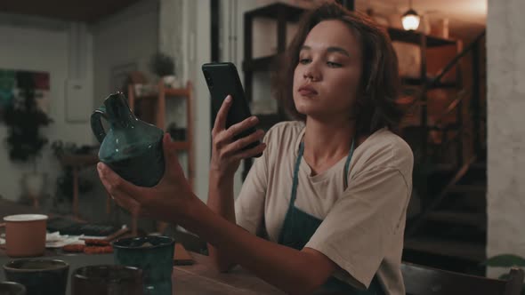 Woman Photographing Handmade Ceramics