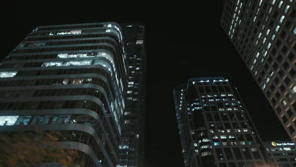 Low angle wide dynamic shot of high rise building at Night, Vancouver, Canada