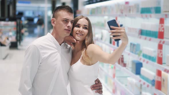 Cute Young Couple Charming Girl and Manly Guy Make Selfie