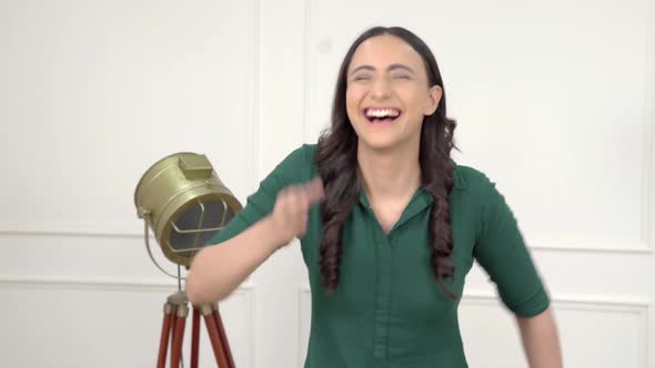 Indian woman laughing on someone