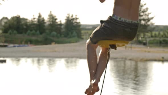 Teenage Boy is Having Fun on the Lake