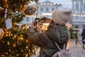 Woman taking photo at Christmas market  - PhotoDune Item for Sale