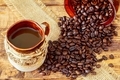 Cup of black coffee and coffee beans on wooden background. - PhotoDune Item for Sale