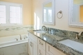 Light bathroom with bathtub and countertop faucet with mixer tap in bathroom - PhotoDune Item for Sale