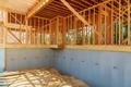 Home Under Construction Close Up with Blue Sky New construction home framing - PhotoDune Item for Sale