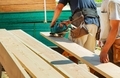 Wood cutting with circular saw male worker or handy man with power tools - PhotoDune Item for Sale