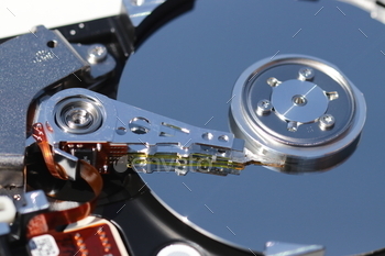 Open hard drive showing metal disk