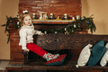 A beautiful little girl is smiling against the background of a Christmas room - PhotoDune Item for Sale