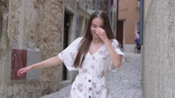 Happy Girl Enjoying the Moment and Dancing in the Street