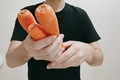 A man holding carrots  - PhotoDune Item for Sale