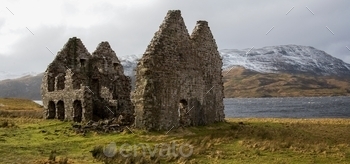Calda House near Ardvreck Castle and Loch Assynt in northwest Scotland. Clan Mackenzie attacked and captured Ardvreck Castle in 1672 and took control of the Assynt lands. In 1726 they constructed a more modern manor house nearby, Calda House. A fire destroyed the house under mysterious circumstances one night in 1737 and both Calda House and Ardvreck Castle now stand as ruins.