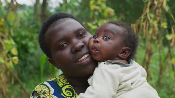 Happy mother holding her baby