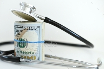money. The expense of doctor or hospital ER visits. Health insurance and healthcare procedure test expenses.  A stethoscope laying on money – the high cost of insurance. Paying healthcare expenses  We need affordable healthcare especially for people on Medicaid and Medicare or a fixed income. MargJohnsonVA