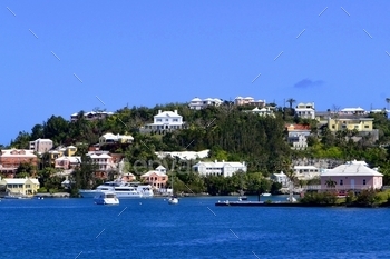 ermuda featuring houses and boats with vivid blue water and sky. An excellent vibrant travel destination, vacation getaway! Background with copy space. MargJohnsonVA