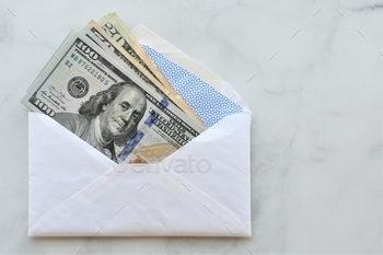 lar bills in a white envelope. $100 $50 $20 background of hundred, fifty, twenty dollar bills from the US government Depart of treasury. The cost of living spending or income in our economy. Deposit or withdrawal from your bank account or credit union. MargJohnsonVA