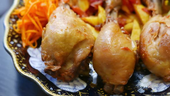 Chicken Thighs with Vegetables on a Plate