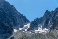 Jagged rock mountain peaks with melting glacier sheets. - PhotoDune Item for Sale