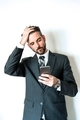 Businessman showing emotion looking at smart phone with hand on forehead.  - PhotoDune Item for Sale