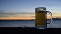 Mug of beer at happy hour sunset outside.  - PhotoDune Item for Sale