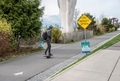 Young person on city park commuter path riding modern skateboard - PhotoDune Item for Sale