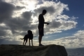 Man and dog in silhouette while on an evening run outside. - PhotoDune Item for Sale