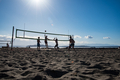 Friends playing beach volleyball - PhotoDune Item for Sale