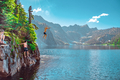 Group of young friends having fun cliff jumping at alpine lake - PhotoDune Item for Sale