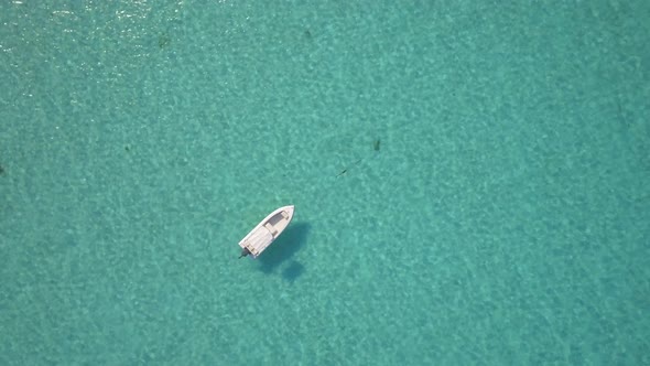 Aerial drone view of a fishing motor boat in the Bahamas, Caribbean. 