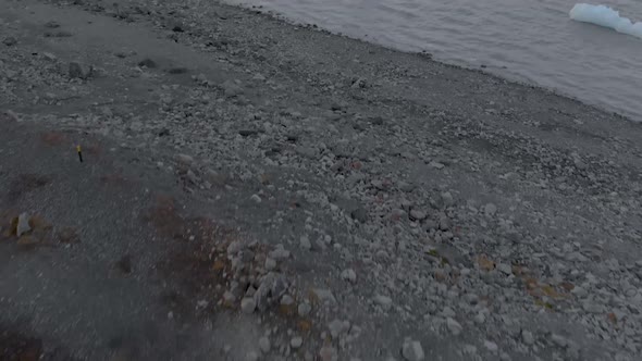 Wide Up Panning Shot of a Glacial Lagoon.