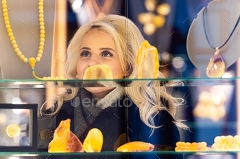 welry at a jewelry store. View through the window from the street side, jewelry, beautiful, window, looking, fashion, female, shop, gold, girl, necklace, ring, shopping, decoration, customer, adult, store, beauty, treasure, woman, desire, display, excited, choosing, buying, showcase, reflection, pendant, standing, glass, smiling, boutique, indoor, wealth, smile, luxury, jewel, through, elegance, dreamy, pretty, surprised, hand, buy, wish, look, amber