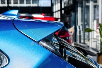  on the roof of a vehicle, Blurry defocused background, fin, automobile, modern, technology, vehicle, equipment, car, transport, antenna, navigation, metal, auto, radio, gps, system, closeup, shark, aerial, rear, design, roof, metallic, concept, shape, mobile, outdoor, reflection, exterior, broadcast, reflecting, automotive, shine, signal, road, tuning, racing, part, waves, plastic, transportation, frequency, accessory, luxury, receiver, detail, view