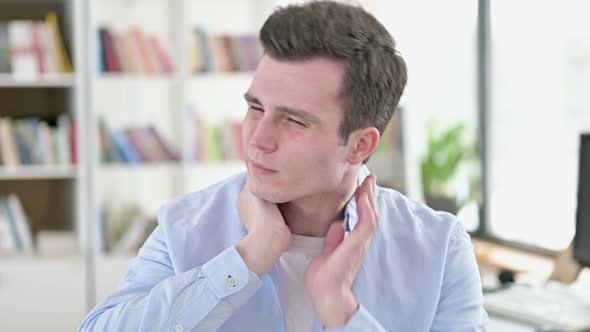 Tired Young Man with Neck Pain