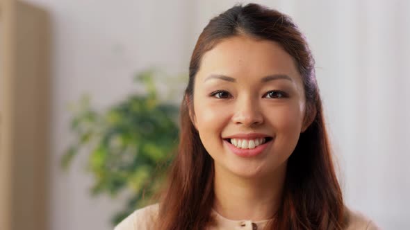 Portrait of Happy Smiling Asian Young Woman