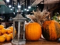 view of an old lantern pumpkin oranges standing in the composition at the entrance to the restaurant - PhotoDune Item for Sale
