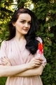 A young beautiful girl in a pale pink dress on the background of a green park - PhotoDune Item for Sale