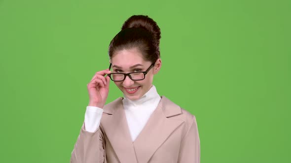 Elegant Woman Flirts and Builds Eyes To the Guys. Green Screen