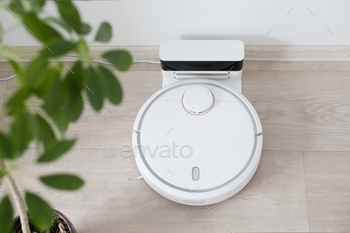 White robot vacuum cleaner, tecnology, smart home