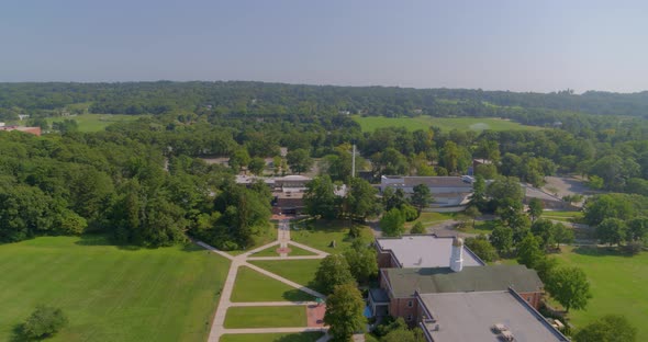 Backwards Pan of  a Small Town Amongst Trees in Long Island New York