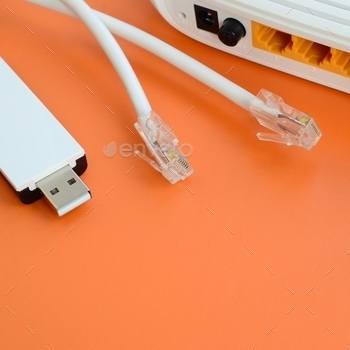 ternet cable plugs lie on a bright orange background. Items required for internet connection