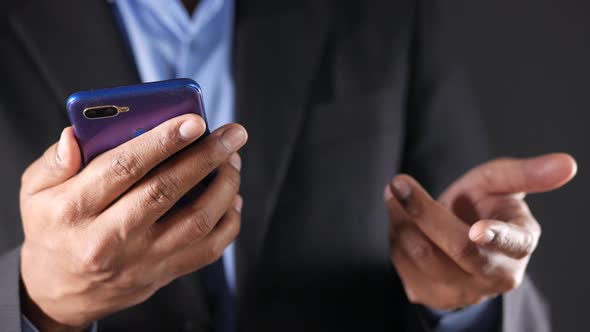 Businessman In a Video Conference Discussing on Smart Phone