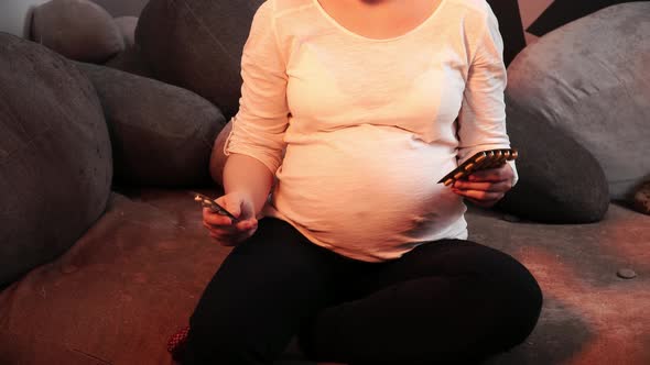 Pregnant Woman Is Making Difficult Choice Between Two Pills Blisters