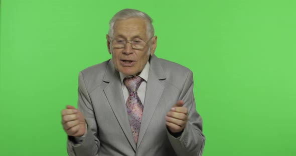 Elderly Businessman in Suit Something Emotionally Tells. Chroma Key Background